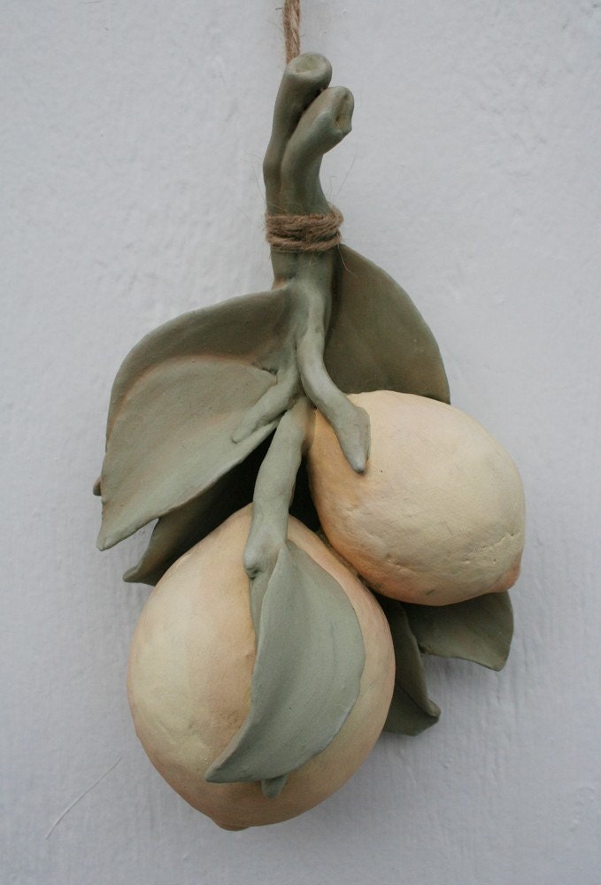 Sculpted ceramic branch with two lemons
