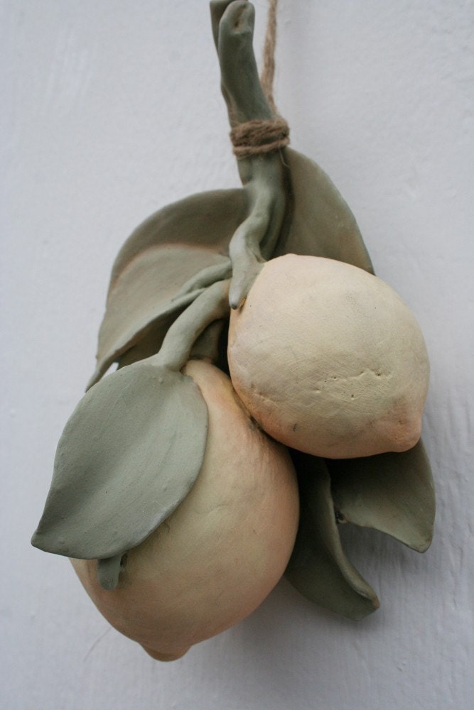 Sculpted ceramic branch with two lemons