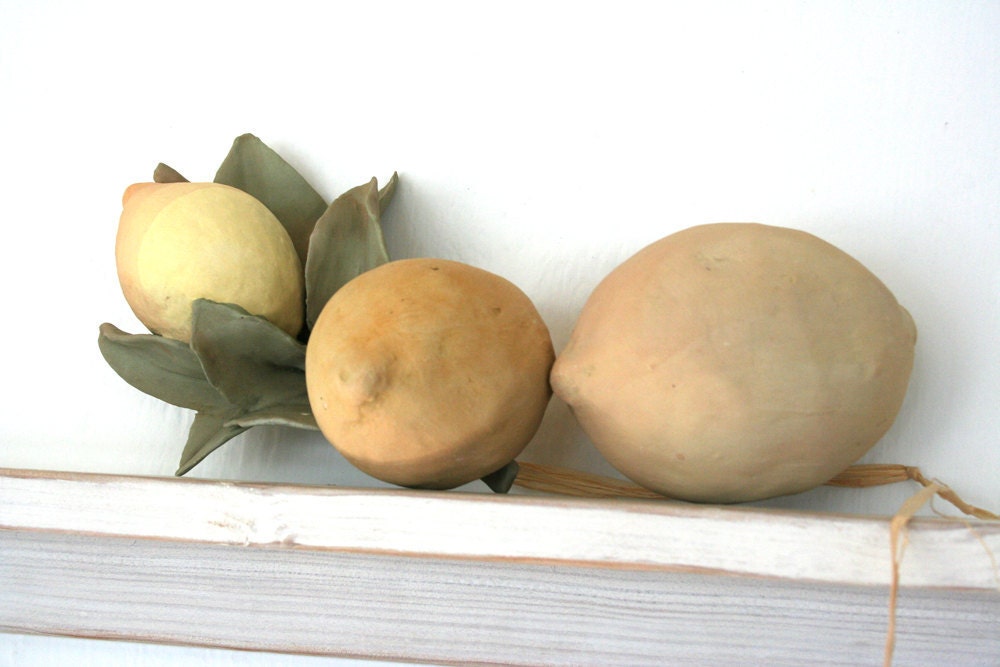 Three hand-built earthenware lemons