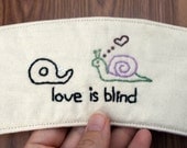 Love is blind cup cozy.
