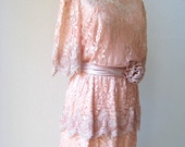 vintage pretty in peach romantic lace dress with rosette sash by Miss Elliette.  size Large/X-Large