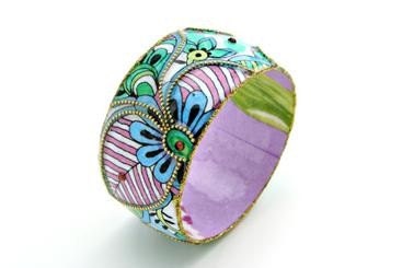 Wide bangle with colorful purple, white, blue and green flowers print coated resin.
