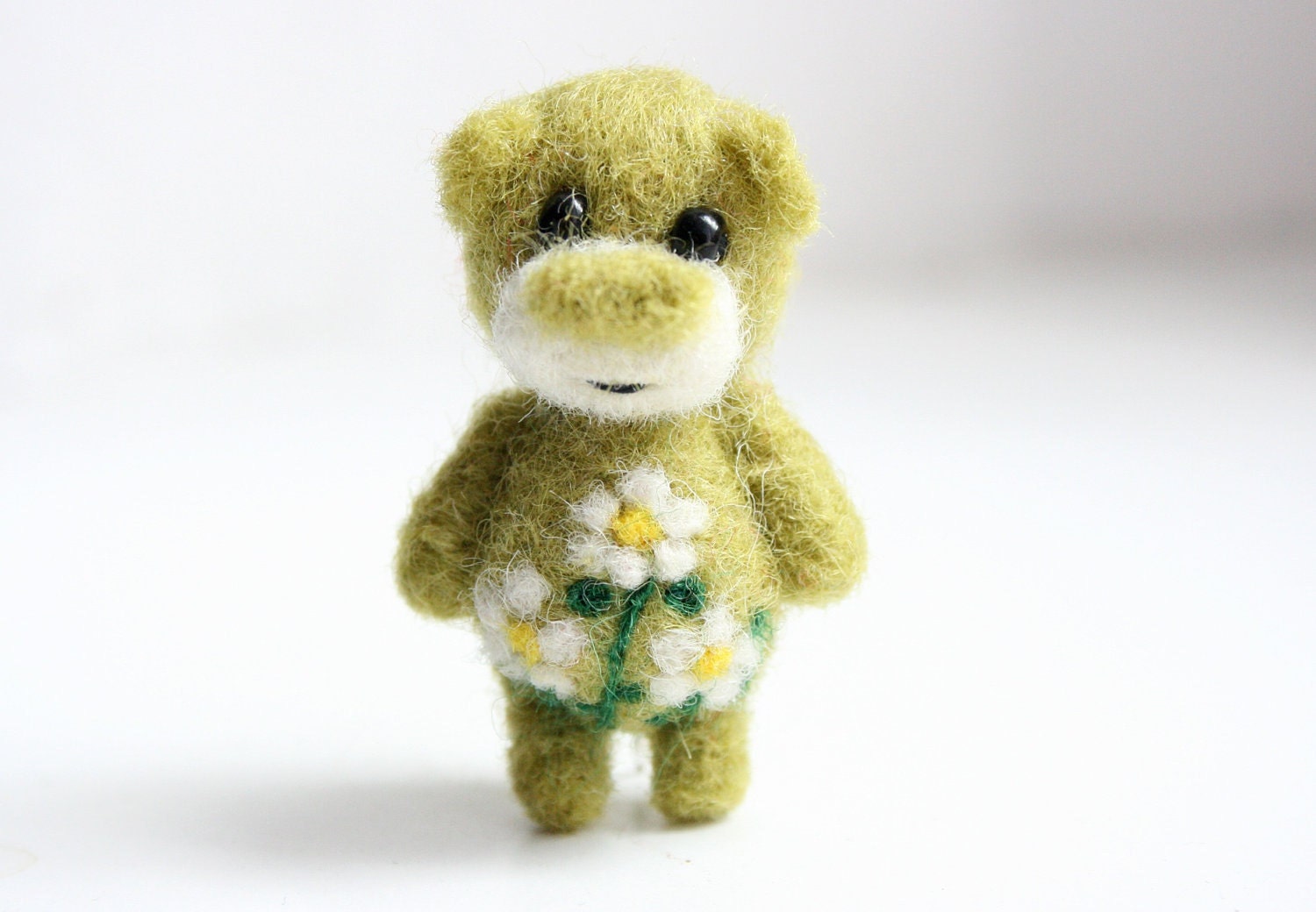 Miniature green felted summer bear