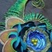 Beautiful Peacock hair clip with large flower.