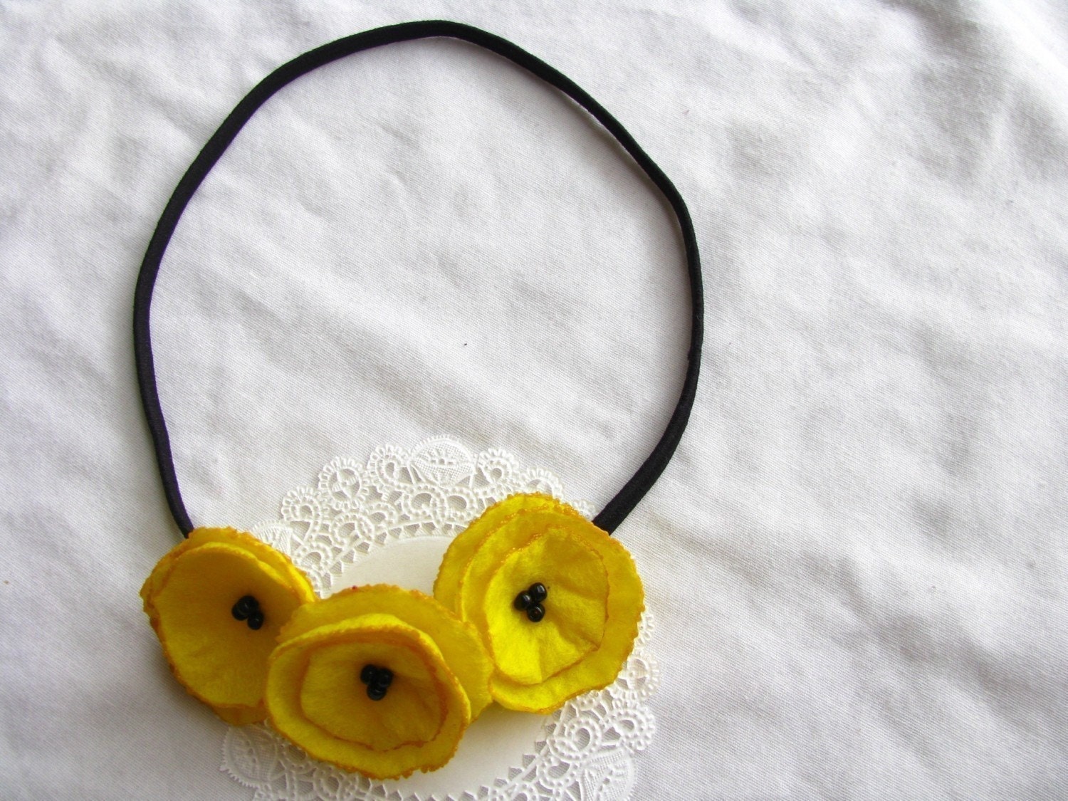 just friends yellow felt poppy garland headband.