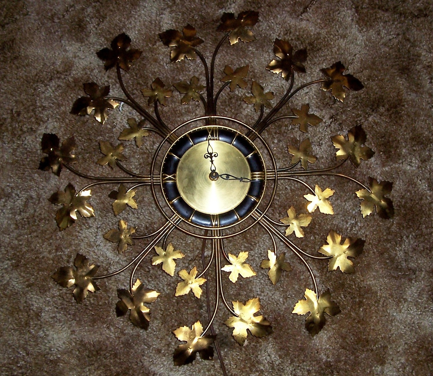 Eames Era Sunbrust wall clock