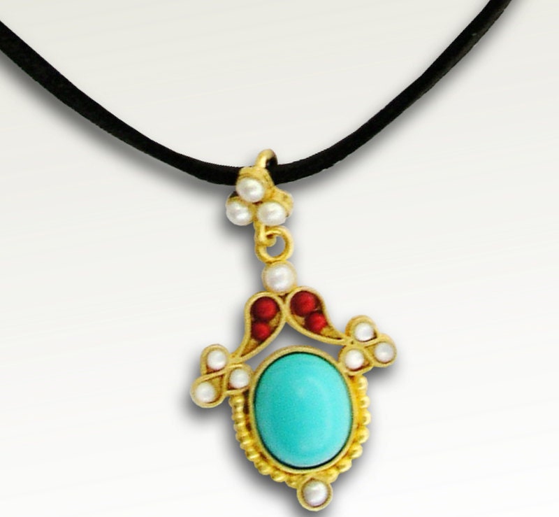 Plated gold with turquoise and coral stones on black suede necklace - The grass is green