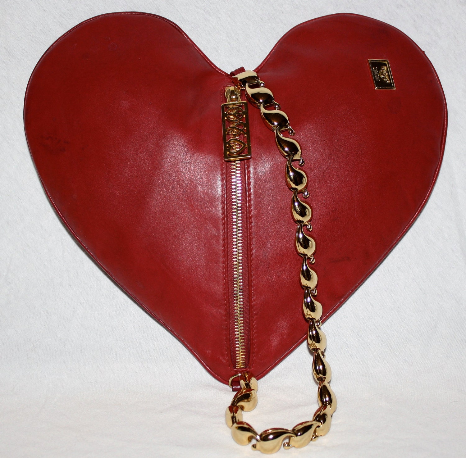 Reserved.....................Authentic VINTAGE MOSCHINO Clutch Soft Leather Heart Gold Chain Handbag