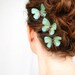 three handmade emerald green silk butterfly hair clips . emerald gypsies . pure dupioni silk