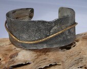 Textured sterling silver and bronze bracelet