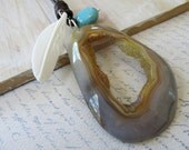 Druzy agate necklace / open pendant with a white feather bone and a turquoise bead on leather - Chan Luu style