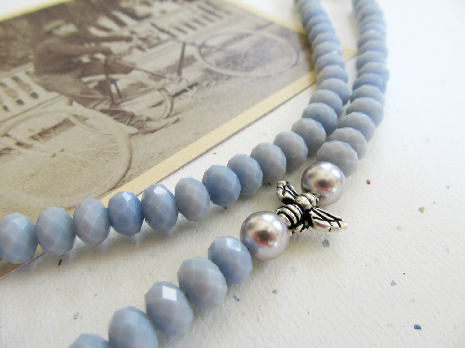 Simple strand beaded necklace - icy blue velvet Czech glass beads with two pearls and bee charm