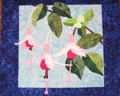 Quilted Wall Hanging - Pink Fuchsia and Green Leaves against Sky Blue Background and Dark Cobalt Borders