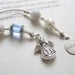 Beaded Bookmark - Angel Watching Over You - Beaded Book Thong in Aqua Blue and Silver with Believe Charm