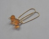 Deep Amber Faceted Glass Rondelle Dangle Earrings in Gold (Red Brass)