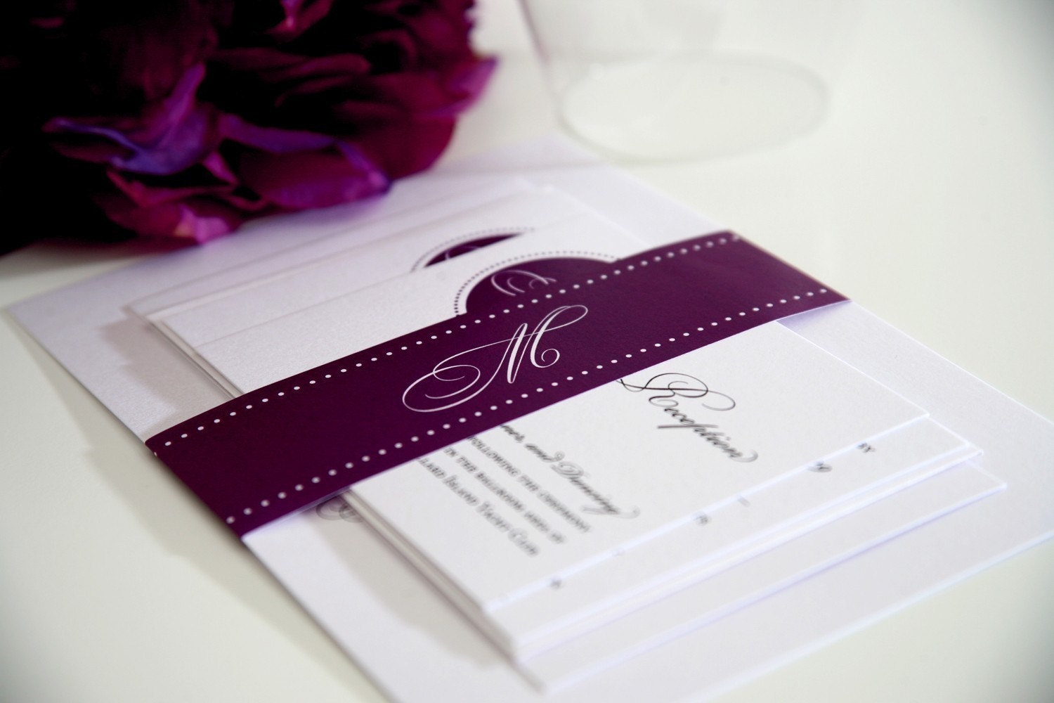 Circle Monogram Wedding Invitations Sample in Purple on Pearl Shimmer Luxury Cardstock