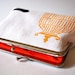 White hemp purse with bird and cage