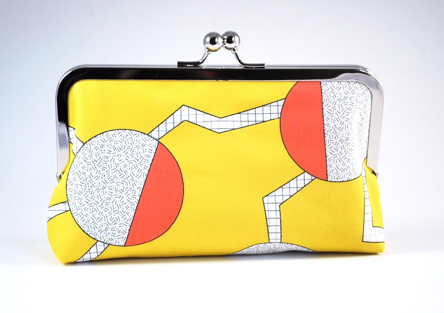 Yellow clutch with circles and zigzags