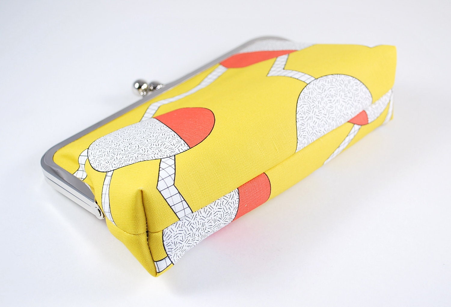 Yellow clutch with circles and zigzags