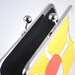 Yellow clutch with circles and zigzags