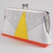 Clutch purse with yellow triangle