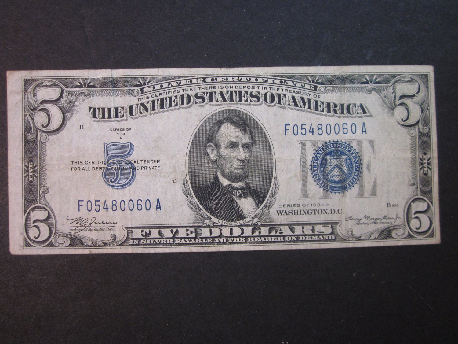 vintage 1934 A silver certificate 5 dollar bill, blue seal note, older paper money