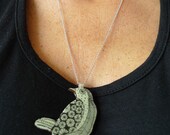 Light green hand drawn bird pendant on a silver chain
