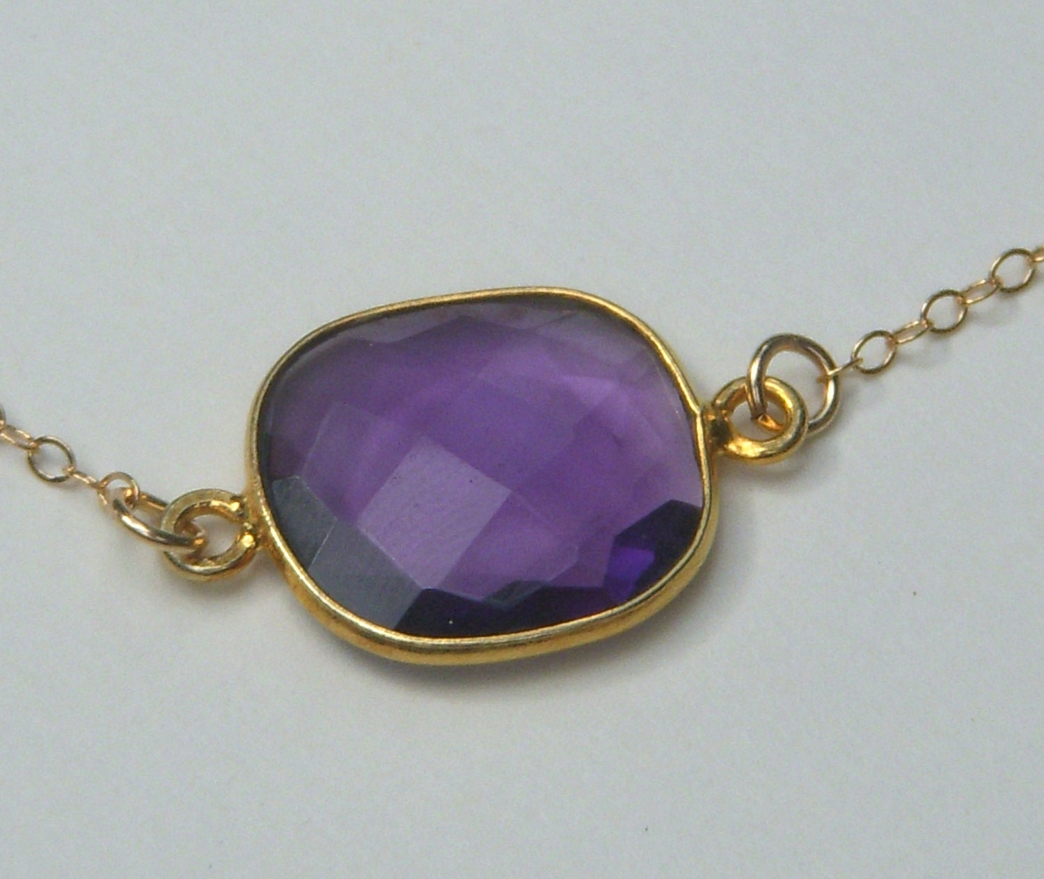 Gold Necklace adorned with a Purple Quartz Bezel Pendant
