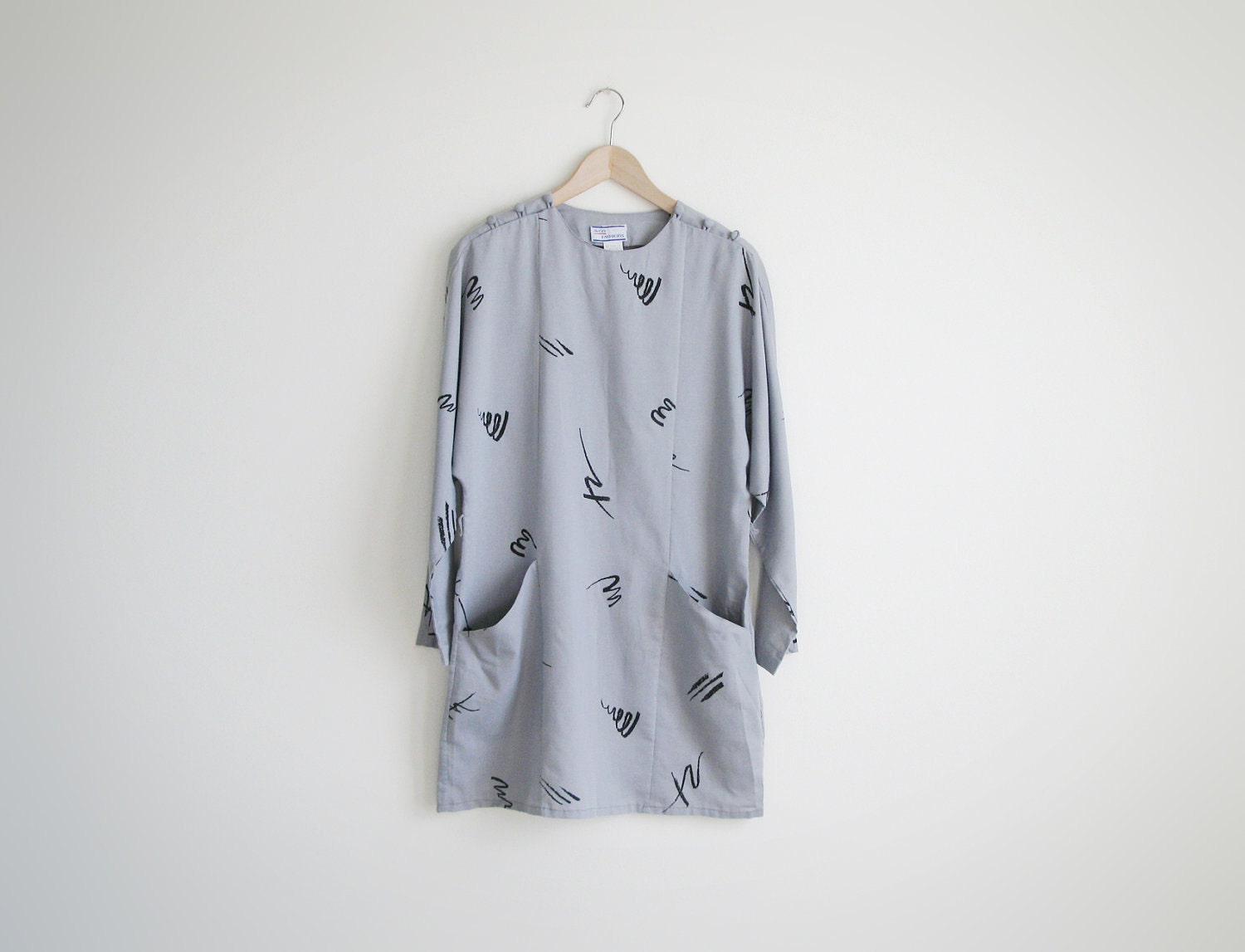 Vintage 1980s grey dress with kimono sleeves.