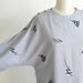 Vintage 1980s grey dress with kimono sleeves.