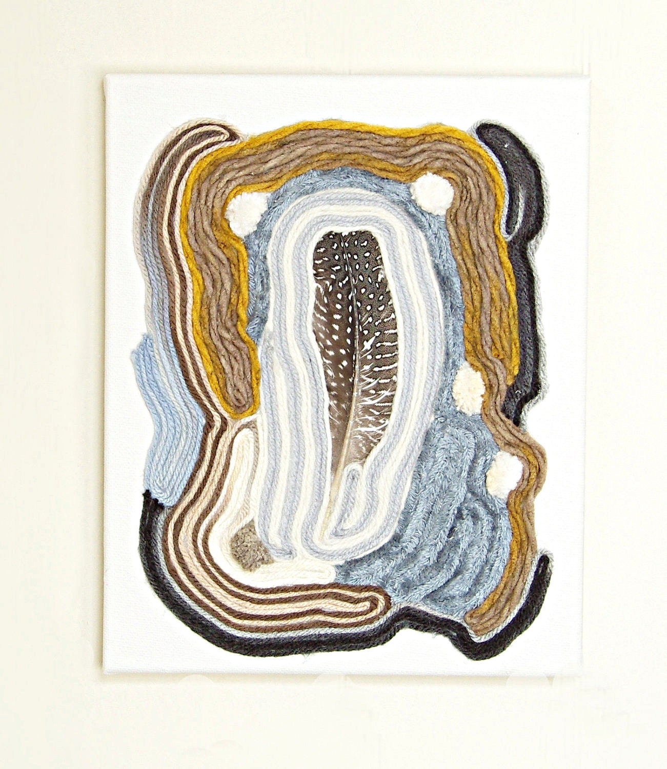 tapestry - textile wall hanging - spotted feather Aztec inspired in white / grey / cream / gold / brown / tan