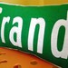 Green and White Grand Street Sign Pillow 12x20