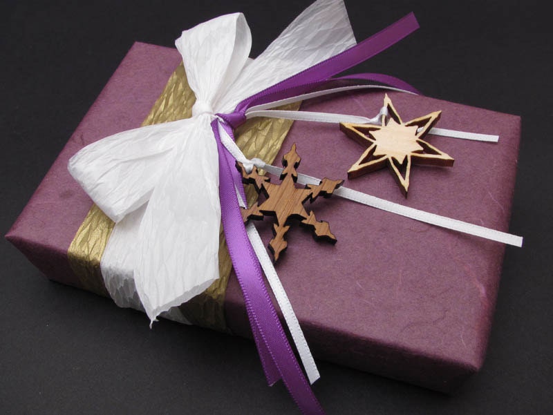 Sugar Plum . Phlox Mulberry Wrap with Wood Snowflake Charms . Gift Wrap Credit - Timber Green Woods