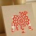 English Bulldog appliqued wall panel - 10 x 10 inches in red and cream wallflower print on natural linen background