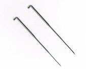 A pair of Felting Needle Light and Heavy and Felting Mat