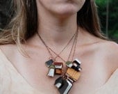 Autumnal Library Book Necklace: 11 antique and scrap leather covered books.