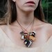 Autumnal Library Book Necklace: 11 antique and scrap leather covered books.