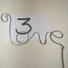 10 Table number holders ( SILVER WIRE WORD ' LOVE ' ) Valentine