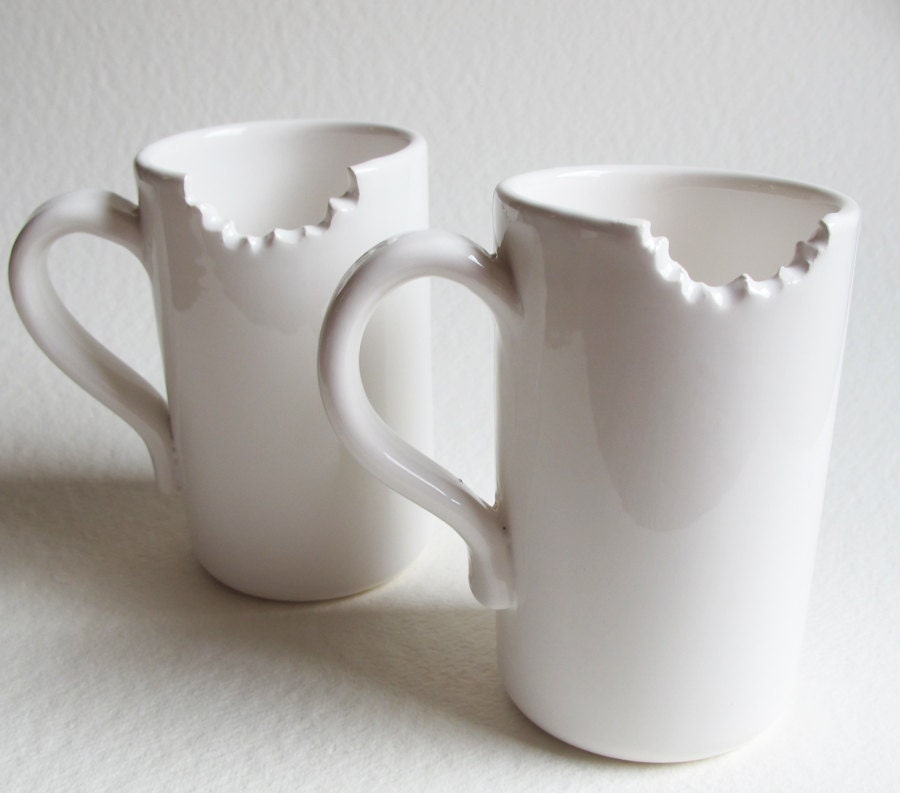 unusual unique set of 2 bitten mugs