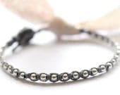 Sterling silver friendship bracelet. beaded - one after the other bracelet in slate gray waxed linen cord