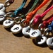 Make a Wish bracelet with Sterling SIlver TINY personalized hand stamped initial on black waxed Irish linen cord
