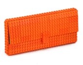 Orange clutch made entirely of LEGO bricks