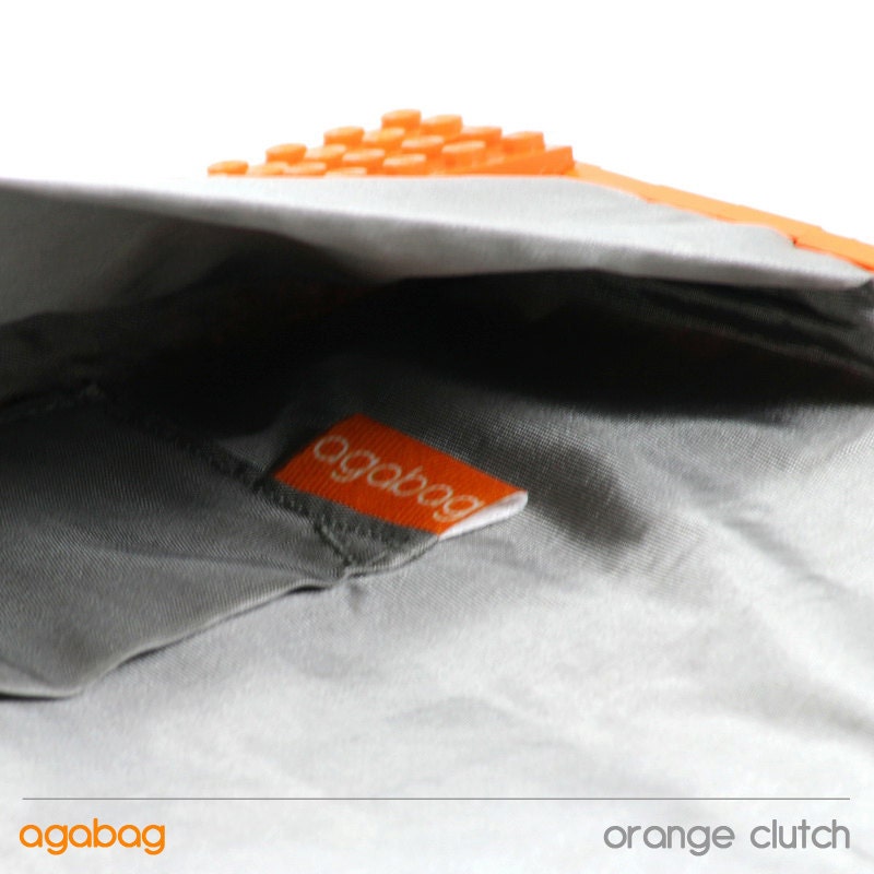Orange clutch made entirely of LEGO bricks