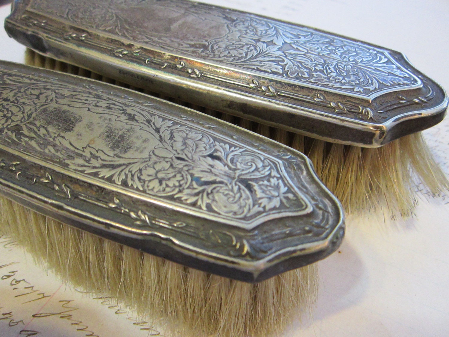 SALE - 2 vintage vanity brushes - quadruple silverplate - tooled metal