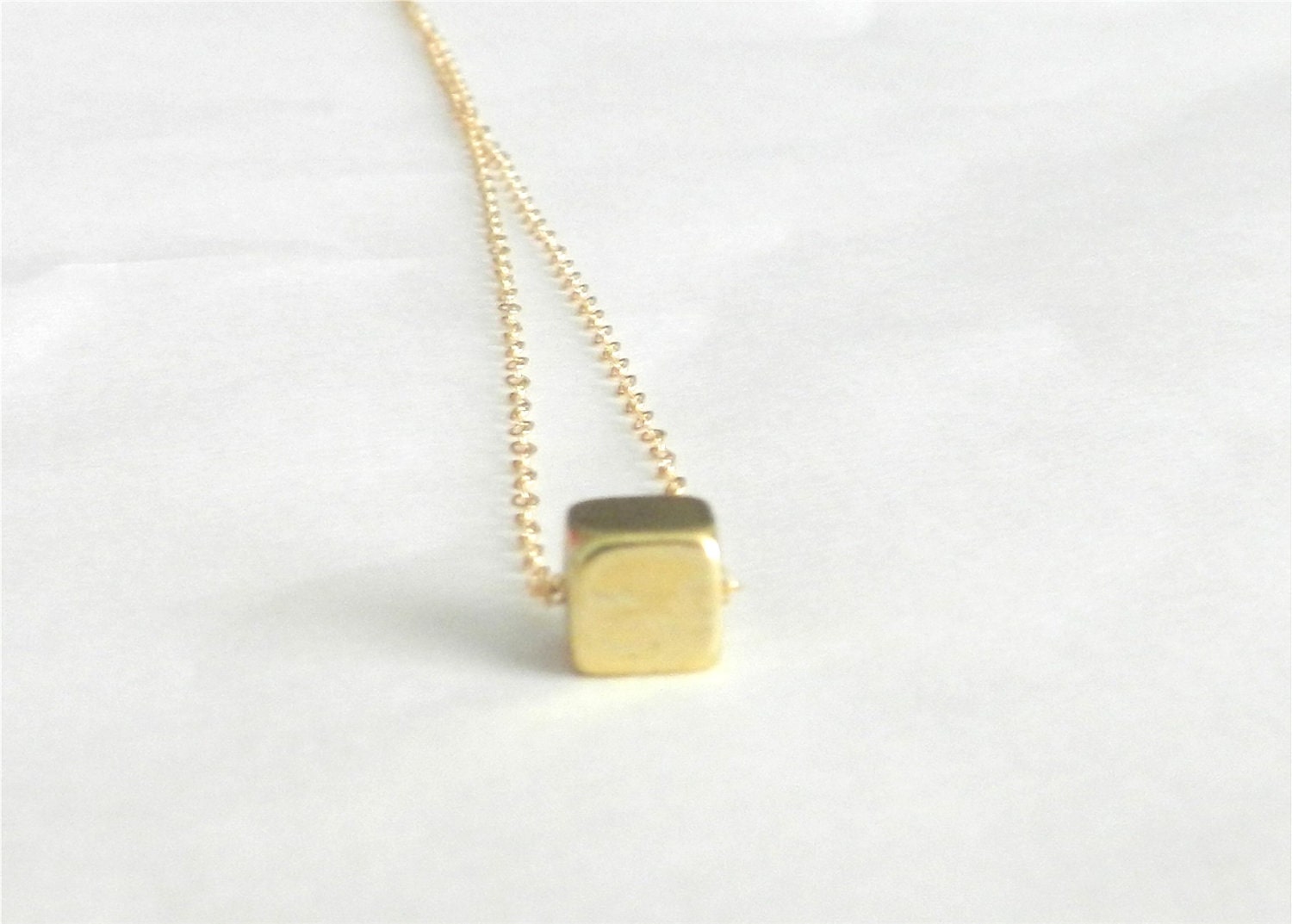 Tiny brass cube, geometric necklace, sleek modern jewelry