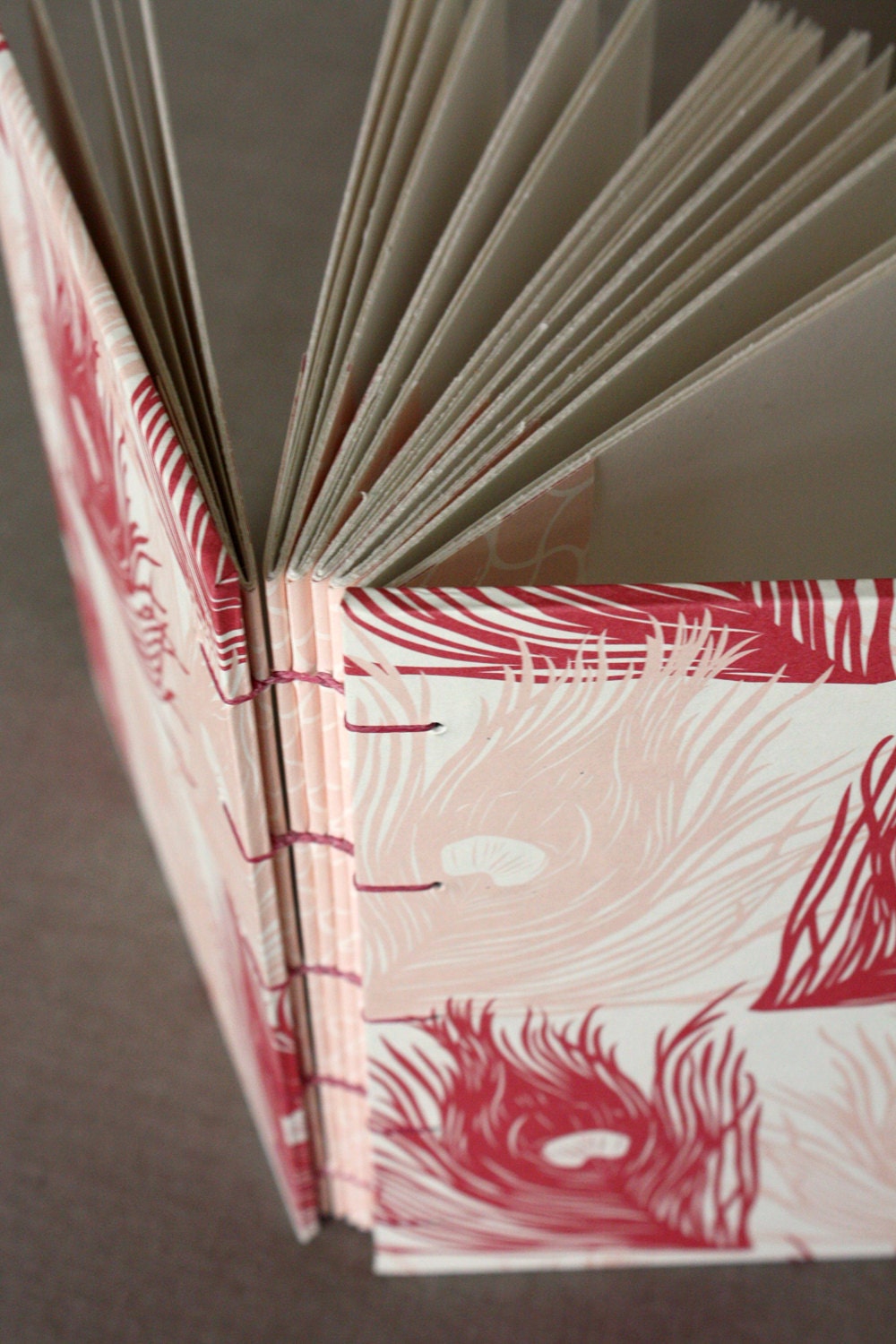 Peacock feather book with Coptic binding
