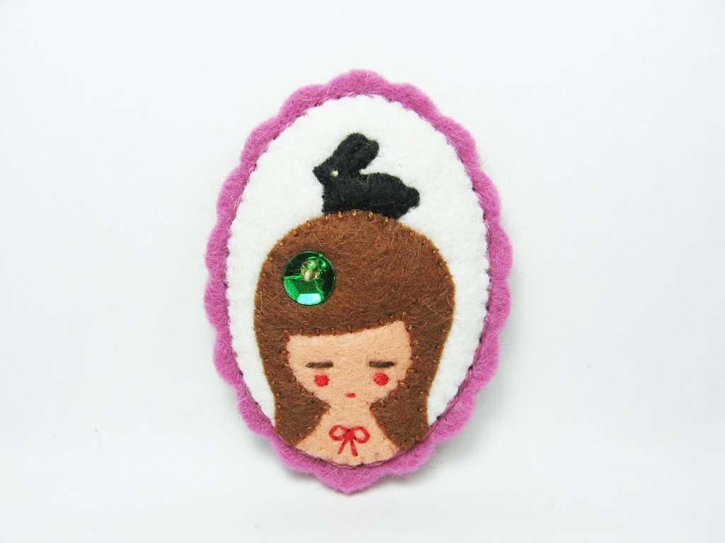 Black candy rabbit with girl felt pin