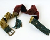 Ornamental knitted belt of bronze cotton yarn, yellow, terra red and blue velvet yarn with metal bronze yarn NAWAR.