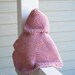 Knit baby poncho with hood in pink 6-9 months made of wool.  Ready to ship.Handmade in Colorado