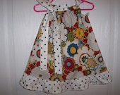 Girls multi colored funky flower pillowcase dress white with black dots ruffle and tie.